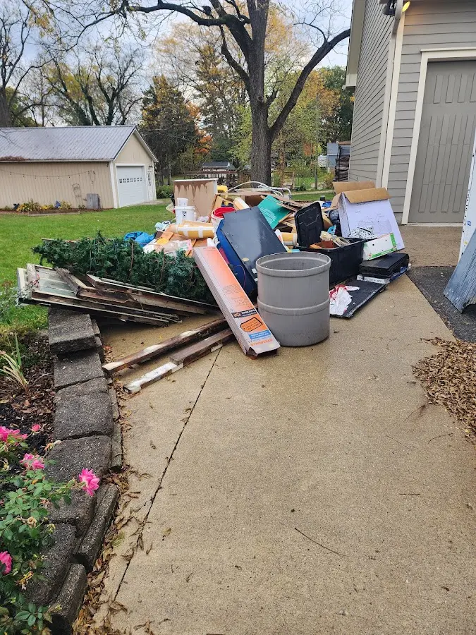 Dumpster being loaded with debris for 30 Yard Dumpster Rental in Polk City